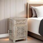 Everest Solid Wood Nightstand with 1 door and drawer, featuring a hand-carved floral design and a distressed, sandblasted finish