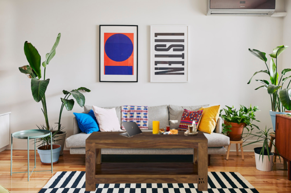 Solid Indian rosewood coffee table with storage tray, handcrafted with unique natural grain for modern living rooms.