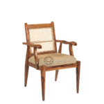 Close-up of Wooden Lounge Arm Chair showing handmade cane detailing, padded upholstered seat, and wooden frame finish.