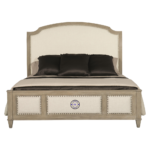 Front view of Banjara Hill Panel Bed King Size made from solid oak wood in neutral Earth finish with upholstered headboard and nailhead trim.