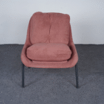 Modern bouclé lounge chair front view with curved arms and metal legs