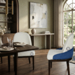 Side view of Ivory Bouclé Crescent Chair in dining room showing curved back and wooden legs