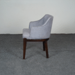 side view of upholstered dining chair with armrests
