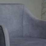 side view of upholstered dining chair with armrests