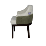 Side view of luxury Bouclé accent chair in dining room showing curved back and wooden legs