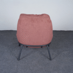 Back view of modern bouclé lounge chair with curved backrest