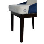 Close-up of wooden legs of Ivory Bouclé Crescent Chair showing solid wood structure and finish