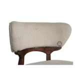 Velora dining chair boucle fabric close up textured upholstery wooden leg detail