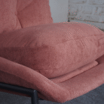 Left side view of bouclé accent chair with modern design