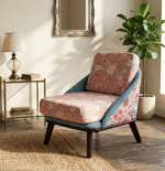 Side view of floral upholstered lounge chair in modern living room setting with wooden legs